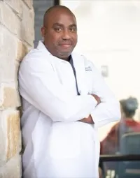 Dr. Aramis Cosme, USCIS-designated civil surgeon at Benefit Wellness Hub Clinic in Houston, Texas